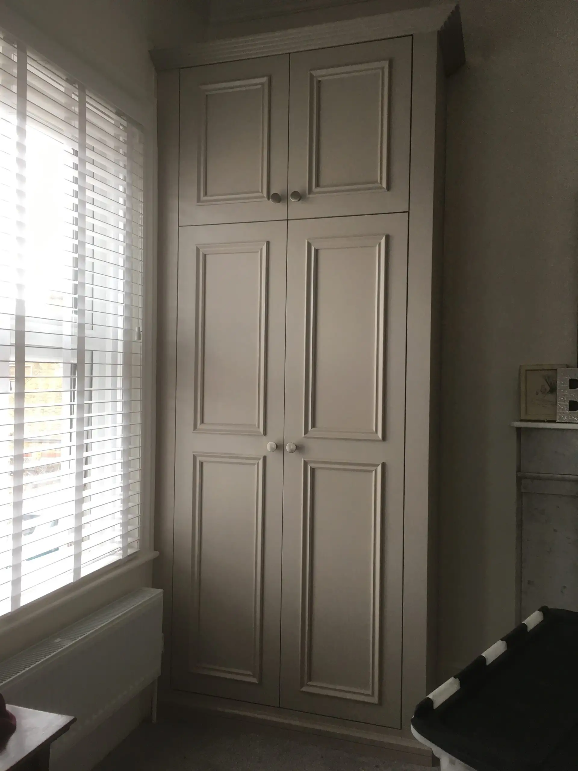 Built in wardrobe with panelled doors creating lots of storage space.