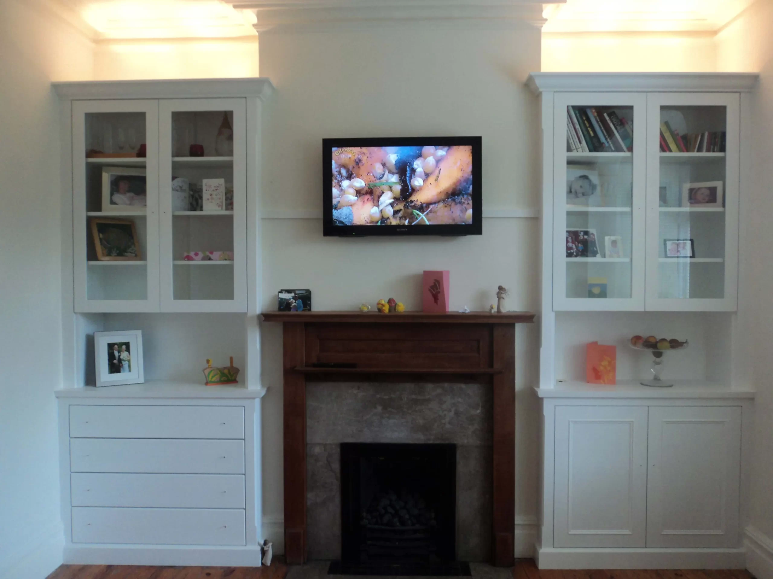 Classic alcove units with drawer fronts up-lighters and glass doors.