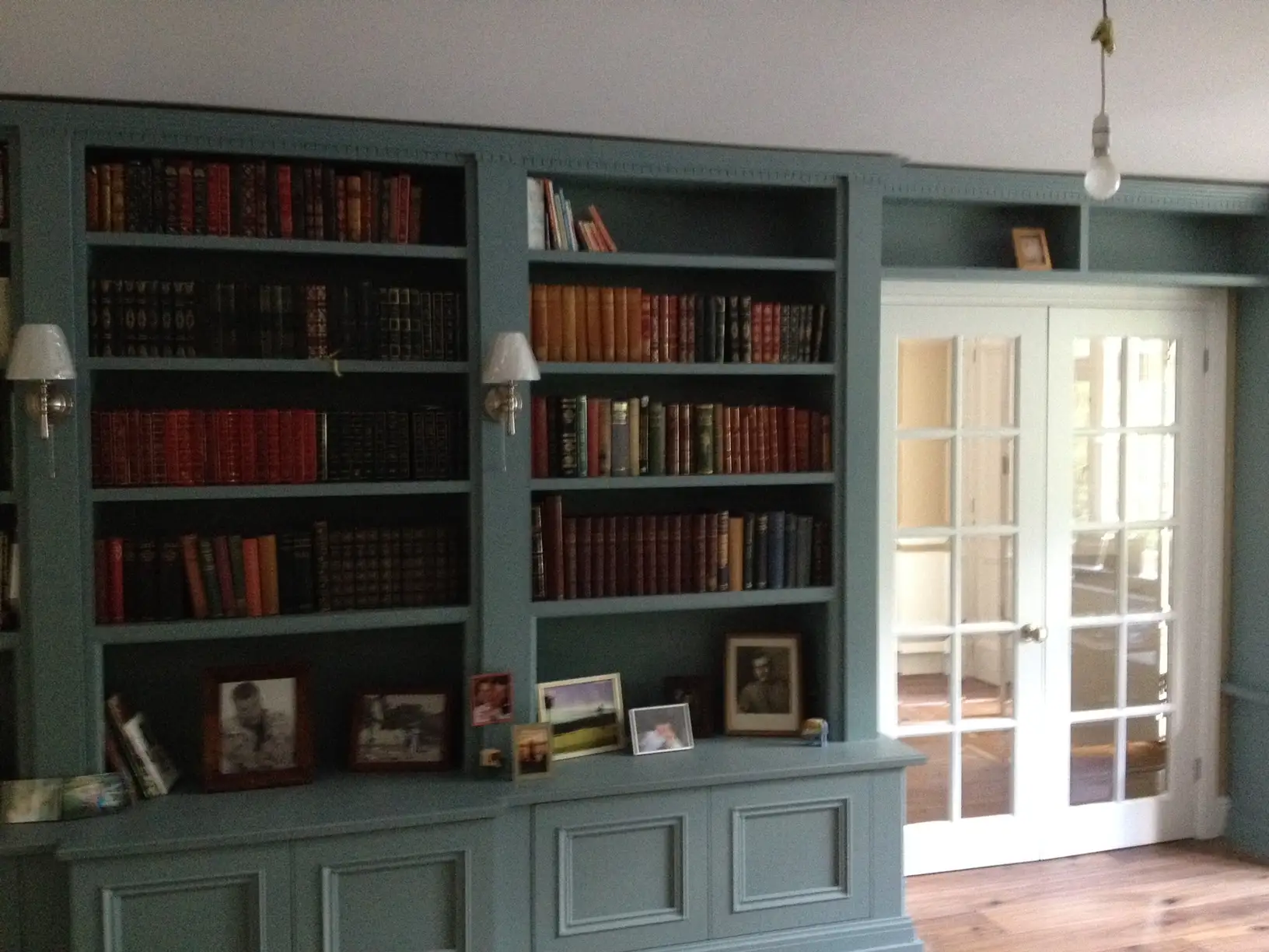 Built in base cabinets with bookcase above for books and display purposes.